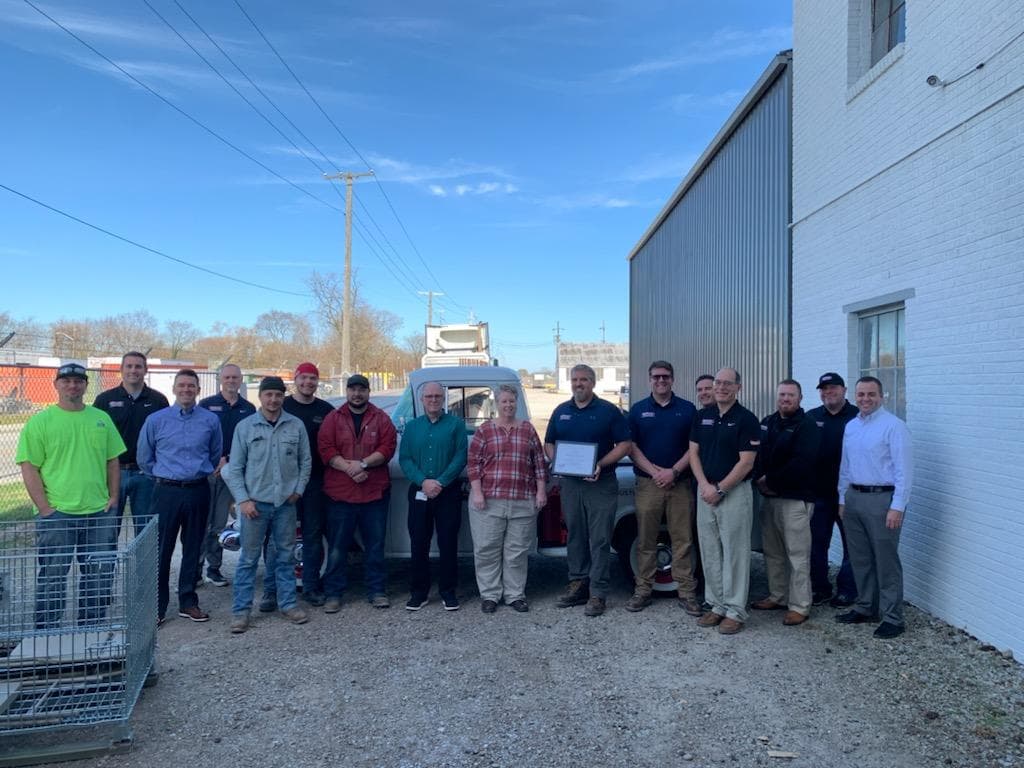 Indiana Department of Labor's VPP Leader Beth Gonzalez presenting plaque for voluntary protection program star status